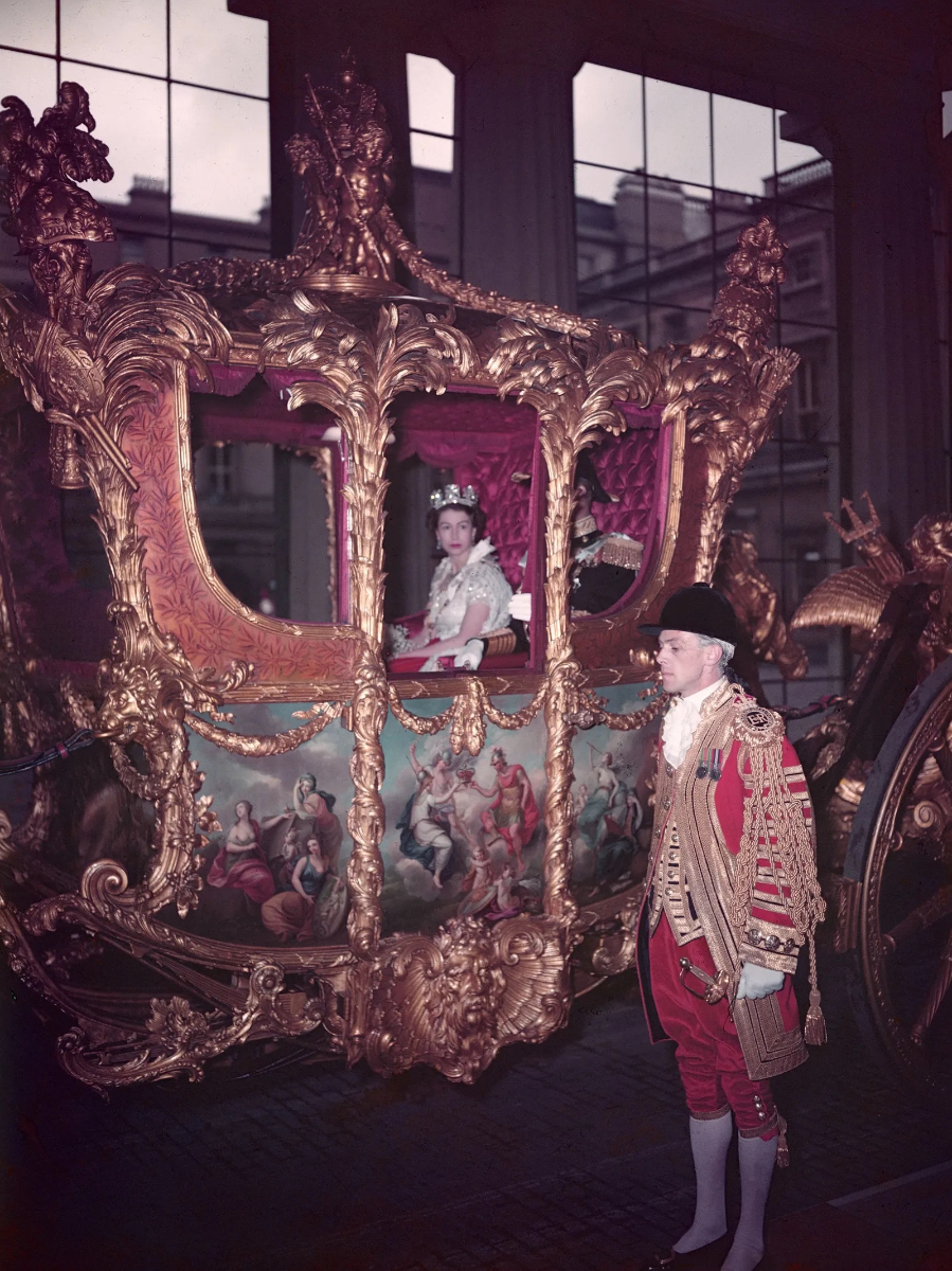 Queen Elizabeth II in the coronation coach on her way to be crowned at Westminster Abbey in 1953. © Getty Images
